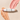 A white dual-ended makeup stick with gold accents and the brand name 'REALITY BARON' printed vertically, styled on a beige background with peach and pink cream swatches.